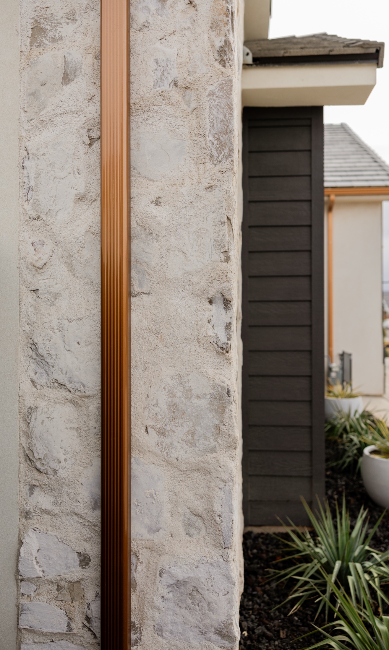 Washington Casita, copper downspout and stone detail